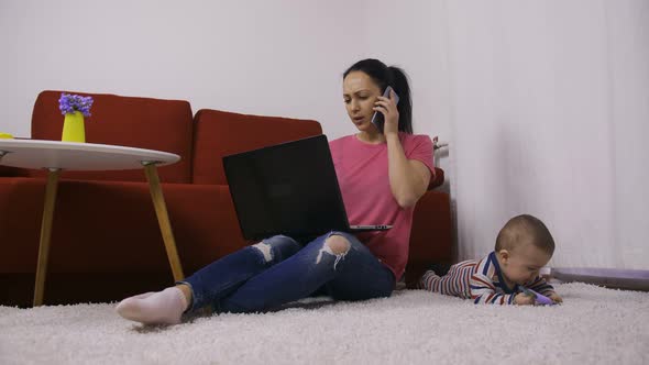 Supermum Multitasking at Home with Baby Son