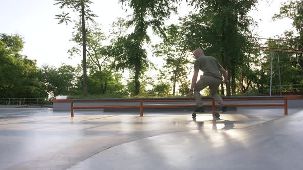 Skateboarder Doing a Tricks in a Concrete Skate Park