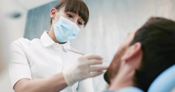 Dentist and Patient in Dentist Office