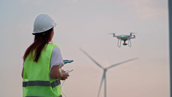 Woman Holding Joystick Controlling Flying Drone Check Correct Operation Windmill