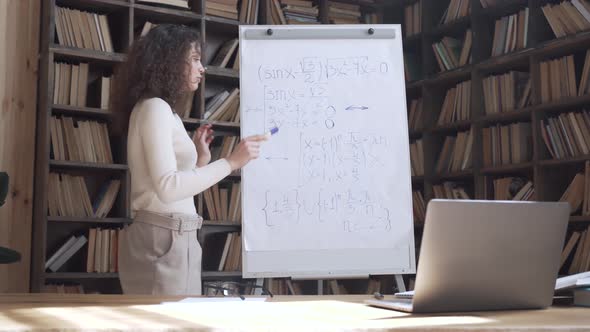 Hispanic Woman Professional Teacher Teaching Math Class Remote Lesson