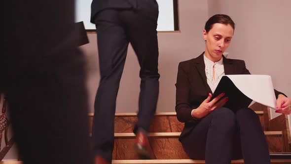 Confused Overworked Business Woman Reading Documents