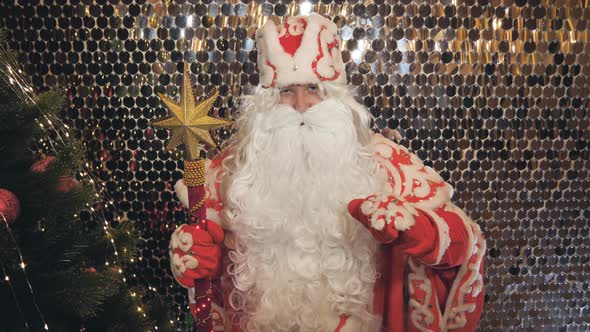 Santa Claus Saint Nicholas is Talking to the Camera Wishing a Happy New Year and Christmas