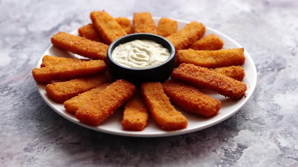 Crumbed Fish Sticks Served with Garlic Dip Sauce