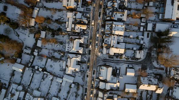 Snowy Streets and Houses in the Early Morning Bird's Eye View