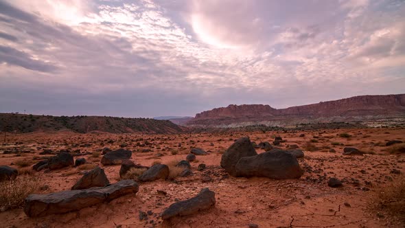 Timelapse of black rocks in the red desert landscape in Capitol Reef