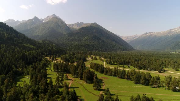 A Beautiful Green Valley at the Foot of the Mountains