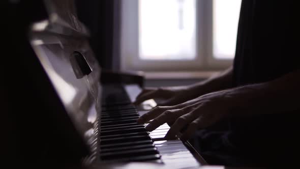 Closeup of Pianist's Hands Professionally Play the Piano