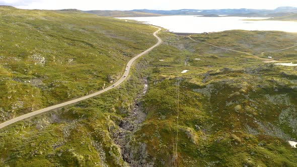 Beautiful landscape with card driving on a scenic route