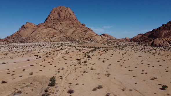 Aerial footage of a huge rocky mountain in Erongo region of Namibia