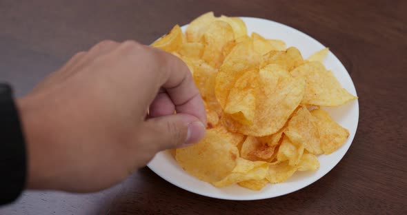 Potato chip on white plate