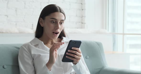 Overjoyed and Excited Female Laughing Celebrating Online Lottery Win