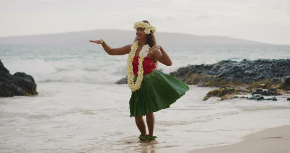 Woman performing Hawaiian hula on the beach