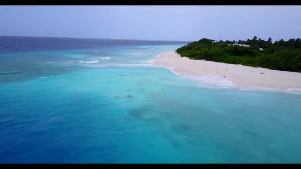 Aerial drone shot landscape of marine bay beach trip by aqua blue water with white sand background o