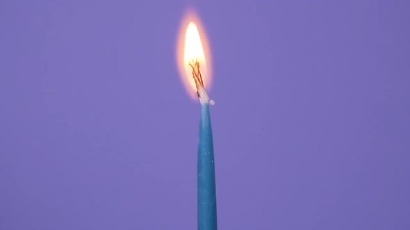 Close Up on Lightning a Candle on a Birthday Cake