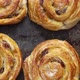 Homemade Puff Pastry Cinnamon Rolls with Raisins Placed on Oven Iron Tray - VideoHive Item for Sale