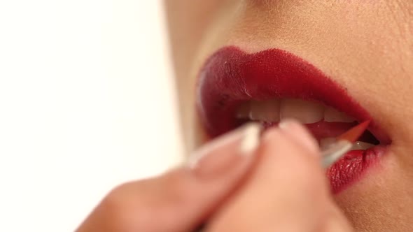 Woman's Face with Fashion Red Lips Makeup. Slow Motion