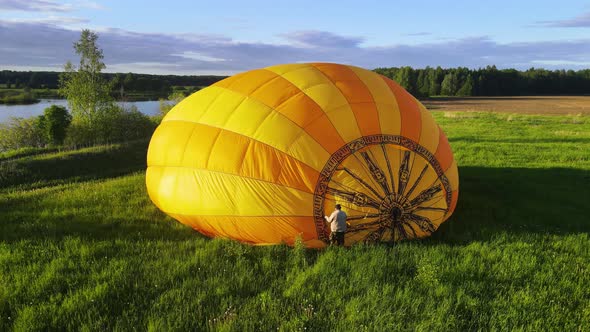 Air balloon is inflated using a burner cases an open flame by burning propane