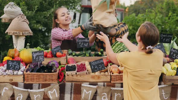 Female Customer Buying Organic Groceries at Farmers Market