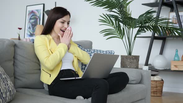 Excited Woman Celebrating Success, Working on Laptop