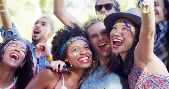 Female friends having fun at music festival 4k