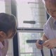 Asian Woman And Daughter Move To New Home Assembling Furniture Together, Daughter Helps Mother. - VideoHive Item for Sale