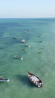 Vertical Video Boats in the Ocean Near the Coast of Zanzibar Tanzania