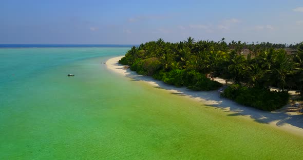 Wide birds eye abstract view of a white paradise beach and blue ocean background in best quality 4K