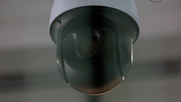 Closeup of Surveillance Video Camera Rotating Around