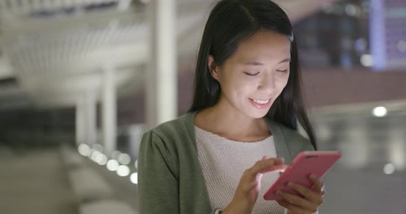 Asian woman use of smart phone at night