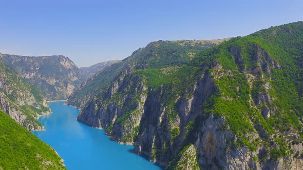 Aerial view on turquoise water in a mountain lake.