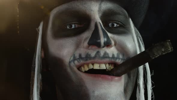 Close Up Shot of Creepy Man Face with Skeleton Makeup Smoking Cigar, Making Faces, Looking at Camera
