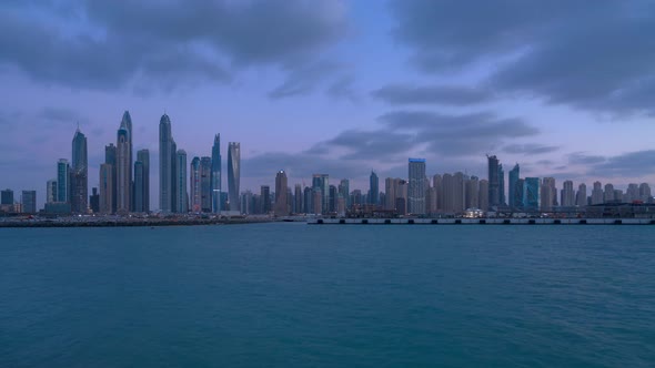 JBR Dubai Skyline Sunset Timelapse from Palm in cloudy weather