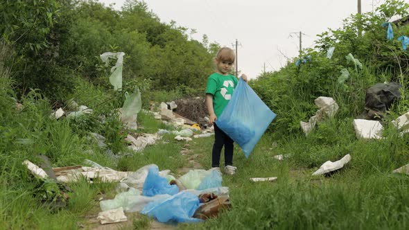 Volunteer Girl Cleaning Up Dirty Park From Plastic Bags, Bottles. Reduce Trash Nature Pollution