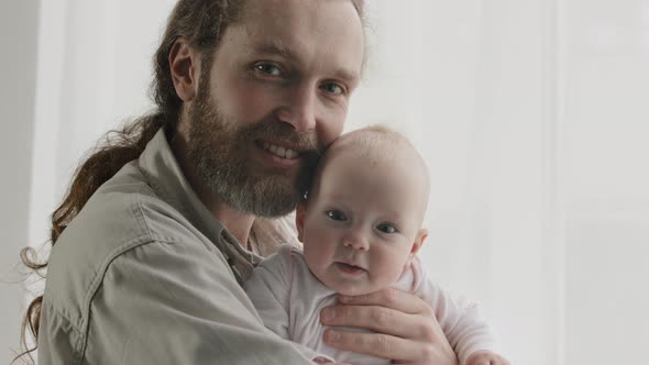 Family Portrait Smiling Caucasian Bearded Dad Father Man Holding Hugging Small Infant Newborn Girl