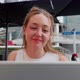 Young woman sitting outdoors videocalling using computer - VideoHive Item for Sale