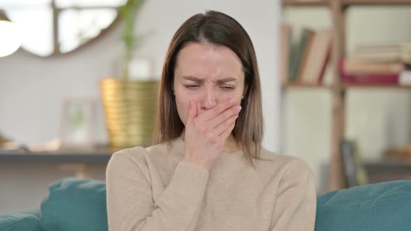 Portrait of Sick Young Woman Coughing at Home