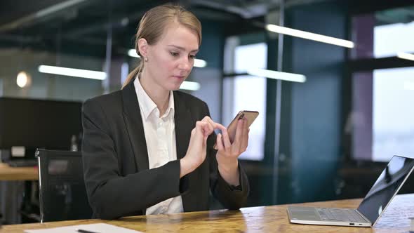 Hardworking Young Businesswoman Having Failure on Smartphone 