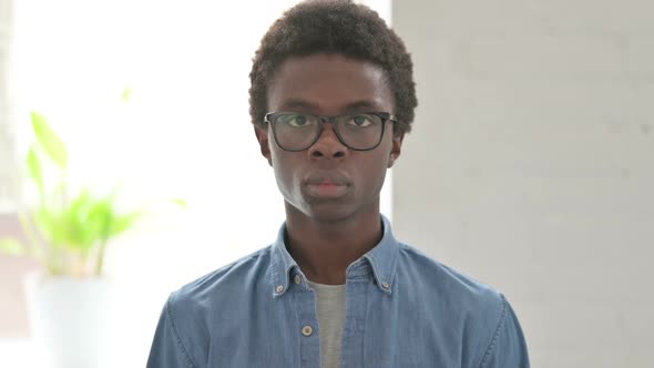 Portrait of Young African Man Looking at the Camera