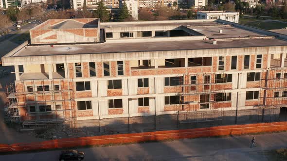 Exterior, non load bearing, red brick walls on a reinforced cement concrete frame: construction site