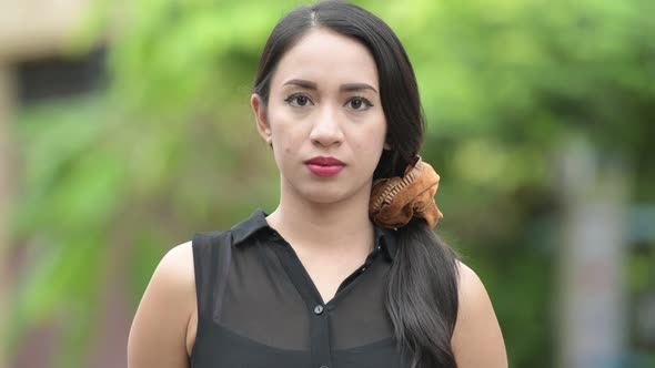 Young Beautiful Asian Businesswoman in the Streets Outdoors