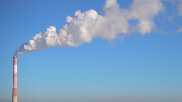 Smoke From the Chimney of Factory and Clear Blue Sky.