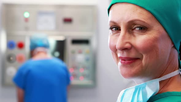 Female nurse in surgical cap at operation theater