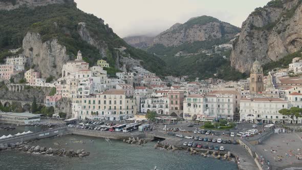 Idyllic italian city on Mediterranean sea. Aerial view of buildings and harbor. Amalfi, Italy, drone