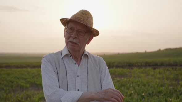 Close Up View of a Old Man in Glasses and Straw Hat