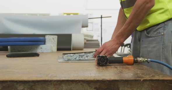 Workers assembling two objects