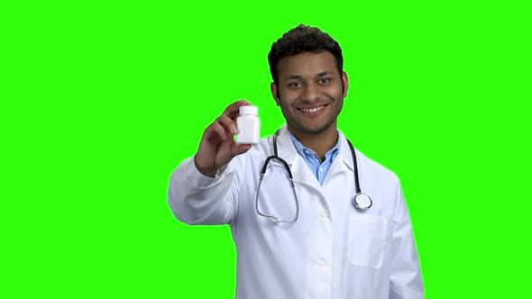 Young Smiling Doctor Recommending Pills