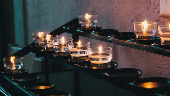 Burning Candles Inside Church Interior Prayer Candles Lit in Row Spirituality