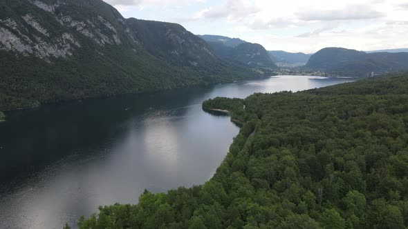 Aerial drone shot of Bohinj lake in Slovenia. Europe summer nature. Lake between mountains.