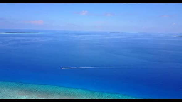 Aerial top down scenery of marine coast beach adventure by blue ocean with white sand background of 